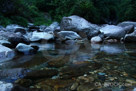 Annapurna sanctuary trek boulder tree river asia.