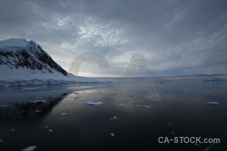 Antarctica sea ice sky adelaide island mountain.