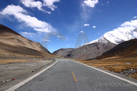 Arid sky east asia snow road.