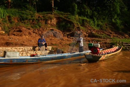 Ban en water person boat laos.