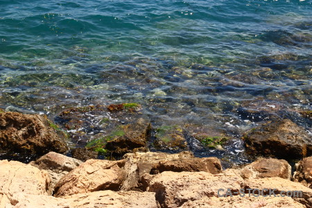 Blue rock water coast sea.