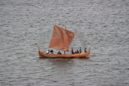 Boat gray vehicle person.