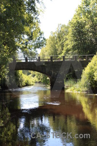 Bridge river building water green.