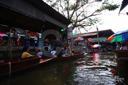 Canal floating person southeast asia damnoen saduak.