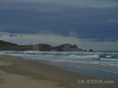 Catlins wave water new zealand sand.