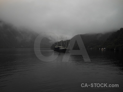 Cloud fiord vehicle boat fiordland.