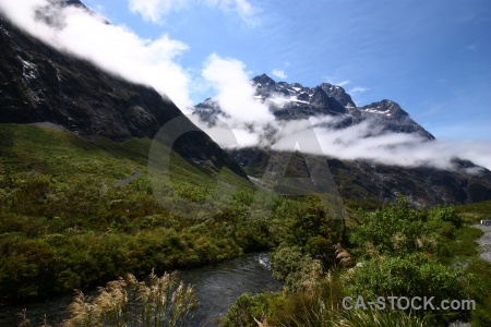 Cloud south island grass snowcap new zealand.