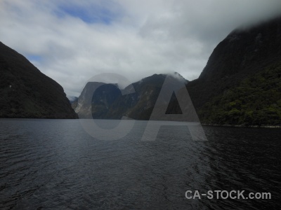 Doubtful sound fiord cloud mountain new zealand.