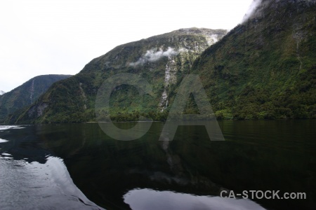 Doubtful sound tree cloud mountain south island.