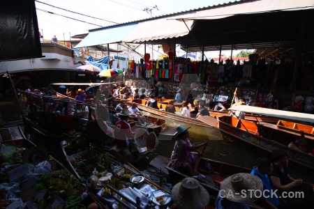 Floating asia person damnoen saduak vehicle.