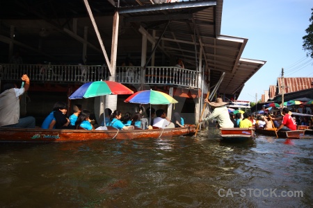 Floating canal person damnoen saduak southeast asia.