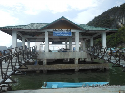 Floating island stilts water building.