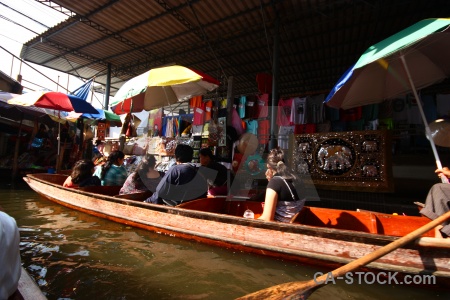 Floating water umbrella boat damnoen saduak.