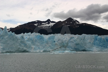 Glacier lake water sky mountain.