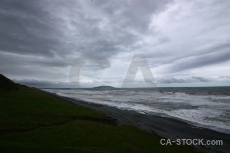 Grass hill water south island sea.