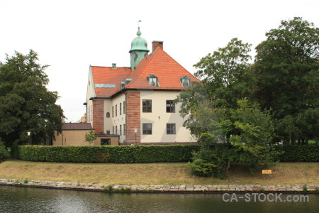 Green castle white building.