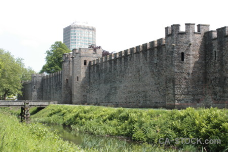 Green castle white building.