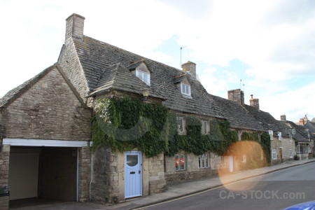 House village street white building.