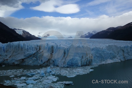 Ice sky perito moreno mountain lake.