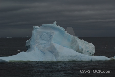 Iceberg antarctica cruise sky marguerite bay adelaide island.