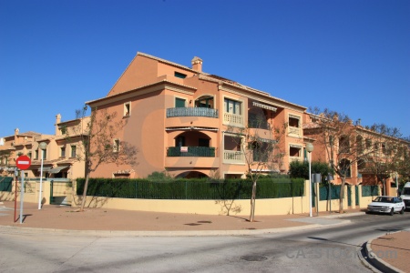 Javea tree sky building road.