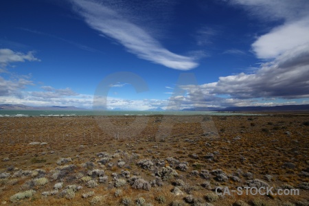 Lake grass sky landscape mountain.