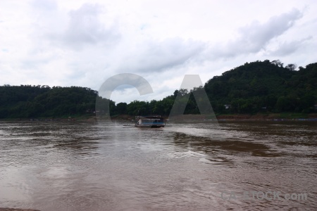 Laos boat sky water river.