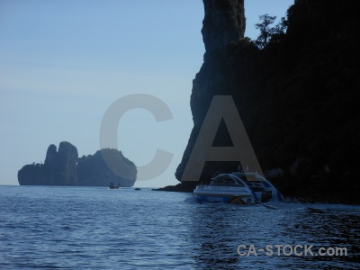 Limestone sky cliff boat thailand.