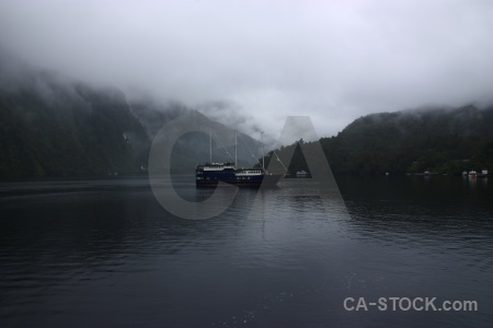 Mountain fiord fiordland doubtful sound boat.