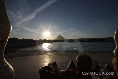 Mountain sunrise javea water contrail.