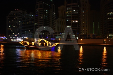 Night marina light reflection water.