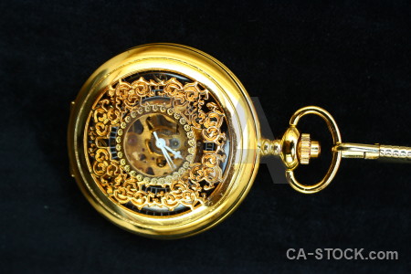 Object pocket watch black orange yellow.