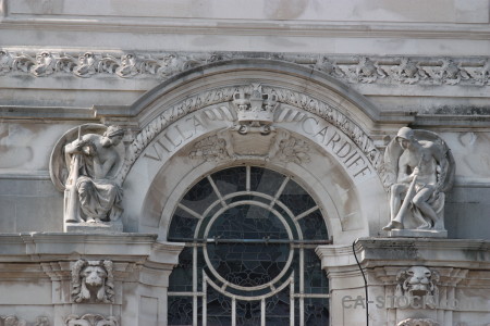 Ornate window building gray.