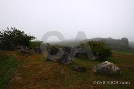 Plain of jars stone rock grass urn.