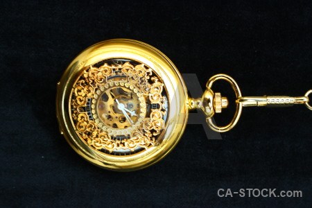 Pocket watch object yellow orange black.