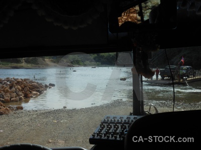 River bus vehicle rock water.