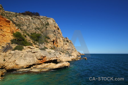 Rock green sea javea europe.