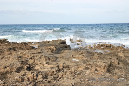 Rock spain sea cloud sky.