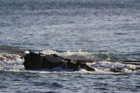 Rock wave water sea surface.