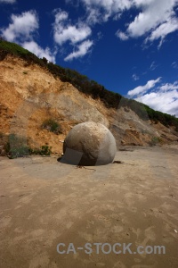 Round rock cliff boulder sky.