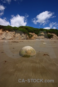 Sand beach new zealand rock moeraki boulders.