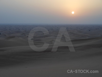 Sand sky dune sun uae.