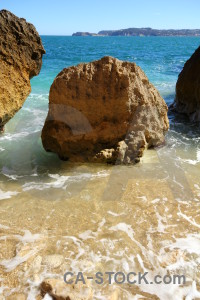 Sea brown rock javea sky.