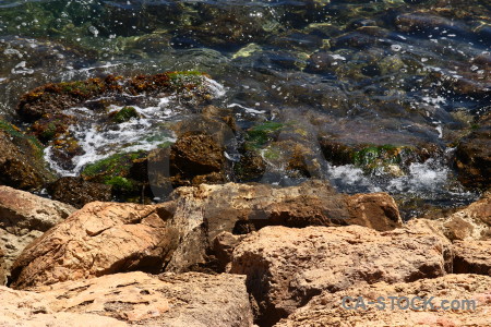 Sea water rock coast brown.