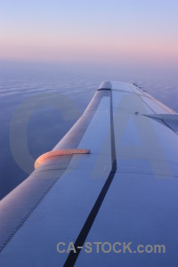 Sky airplane above wing cloud.