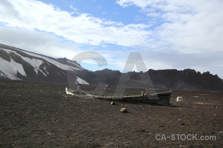 Sky volcano boat wreck sand.