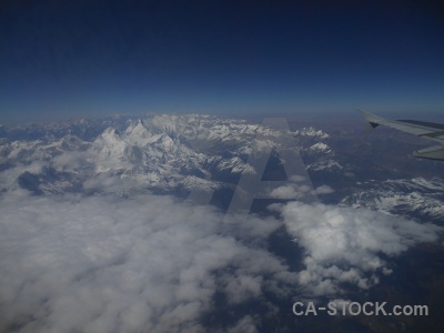 Snow airplane wing aerial mountain.