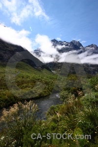 South island mountain snowcap cloud grass.