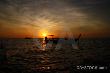 Southeast asia tropical silhouette cloud vehicle.