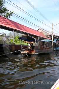 Southeast asia vehicle sky building water.